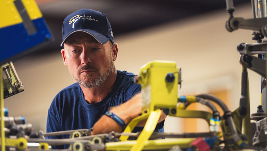 Mechanic working on helicopter