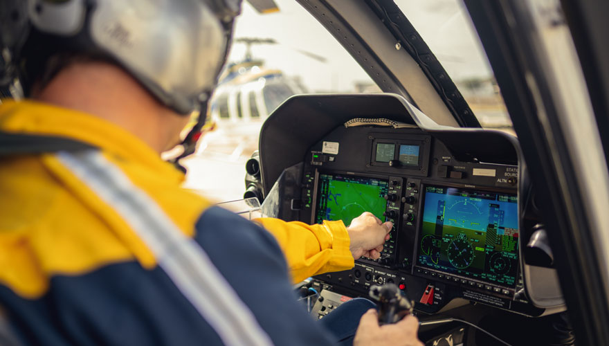 Helicopter pilot adjusting in flight guages